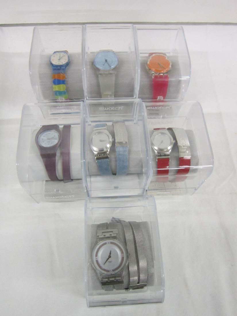 7 Swatch Watches In Original Cases: Seven Swatch Watches In Original Cases,all new old stock, in hard plastic cases with folded information sheets including: Fish Mix, LS 107, Ice Fink, GK 374, Flashlight, GK 375, Doppio Giro, LN 134, S