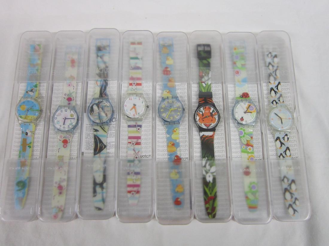 8 Swatch Watches in Original Cases: 8 Swatch Watches in Original Cases, new old stock, all in hard plastic case with folded information sheets including: one Rabelitlo, GE 221, 2009, one Wonder Lake, GS 108, 2003, one Lucky Zoo, GN 229,