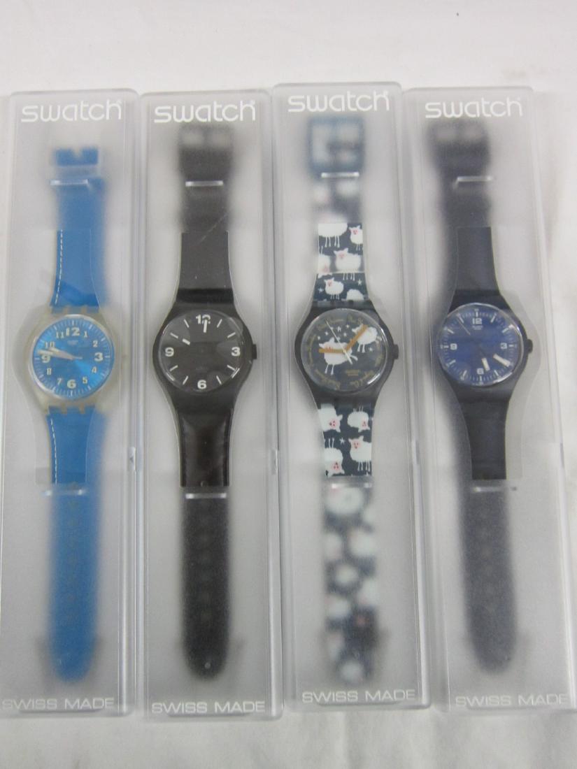 4 Swatch Watches X-Large In Original Cases: Four Swatch Watches X-Large In Original Cases, new old stock, in hard plastic cases with folded information sheets including: Black Sheep Too, SUDN 101, Blue Wing, SUDN 101, Blue Wing, SUDN 100, Ocean