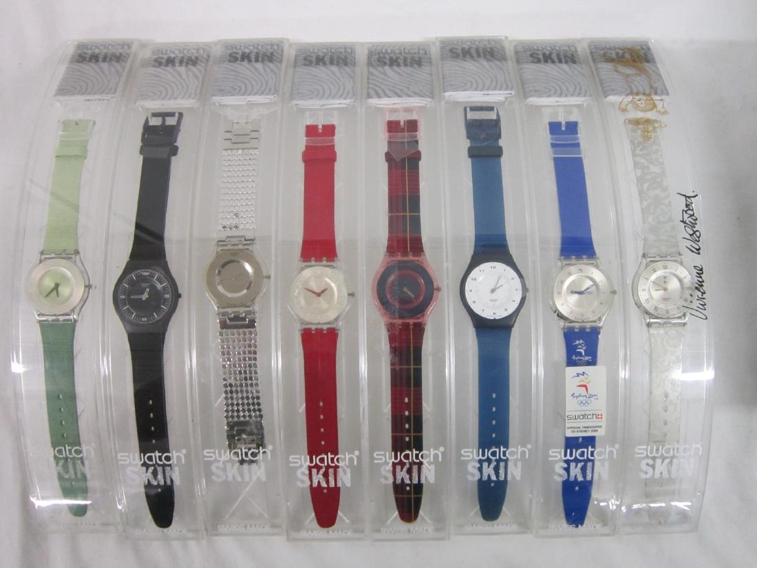 8 Swatch Watches SKIN In Original Cases: 8 Swatch Watches SKIN In Original Cases, new old stock, in hard plastic cases with folded information sheets including: Noir de Chine, SFB 107, Paved in Silver, SFK 103, Apasionada, SFK 108, Kiltnania