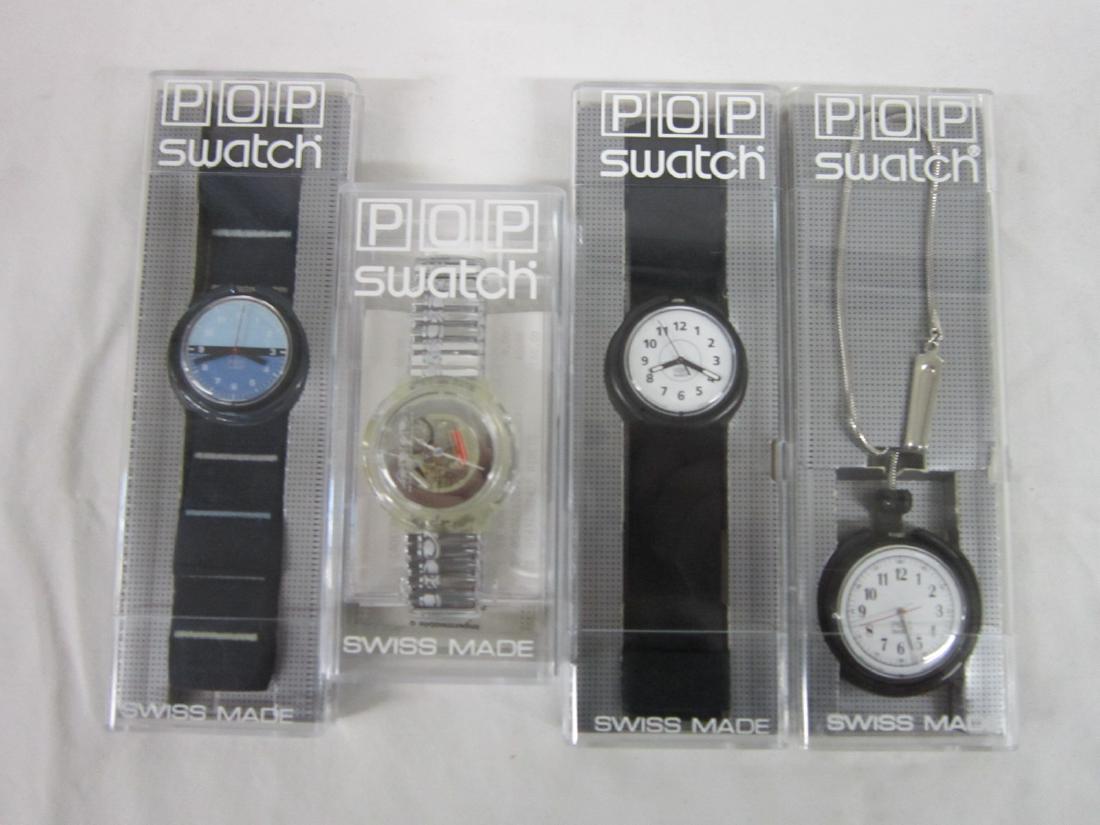 4 Swatch Watches "POP" In Original Cases: 4 Swatch Watches "POP" In Original Cases, all new old stock, in hard plastic cases with folded information sheets including: Embroidery, PMK 120, Periscope, PMB 115, Memento, PPB 101 (with chain) and