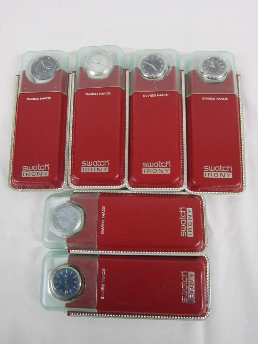 6 Swatch Watches in Original Cases: Six Swatch Watches in Original Cases, Irony, new old stock, in red cardboard and plastic top cases with folded information sheets including: Euphoria, YLS 110, 1998; In-Centric, YLS 112, 1998; Parousi