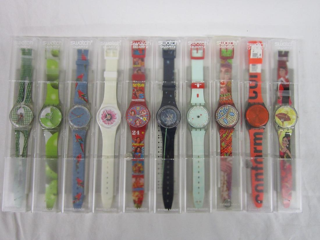 10 Swatch Watches in Original Cases: Ten Swatch Watches in Original Cases, new old stock, in hard plastic cases with folded information sheets including: Blowing Away, GN 207, 2003; Clone, G6, 178, 1999; Ravenna, GR 107, 1990; Conform, G