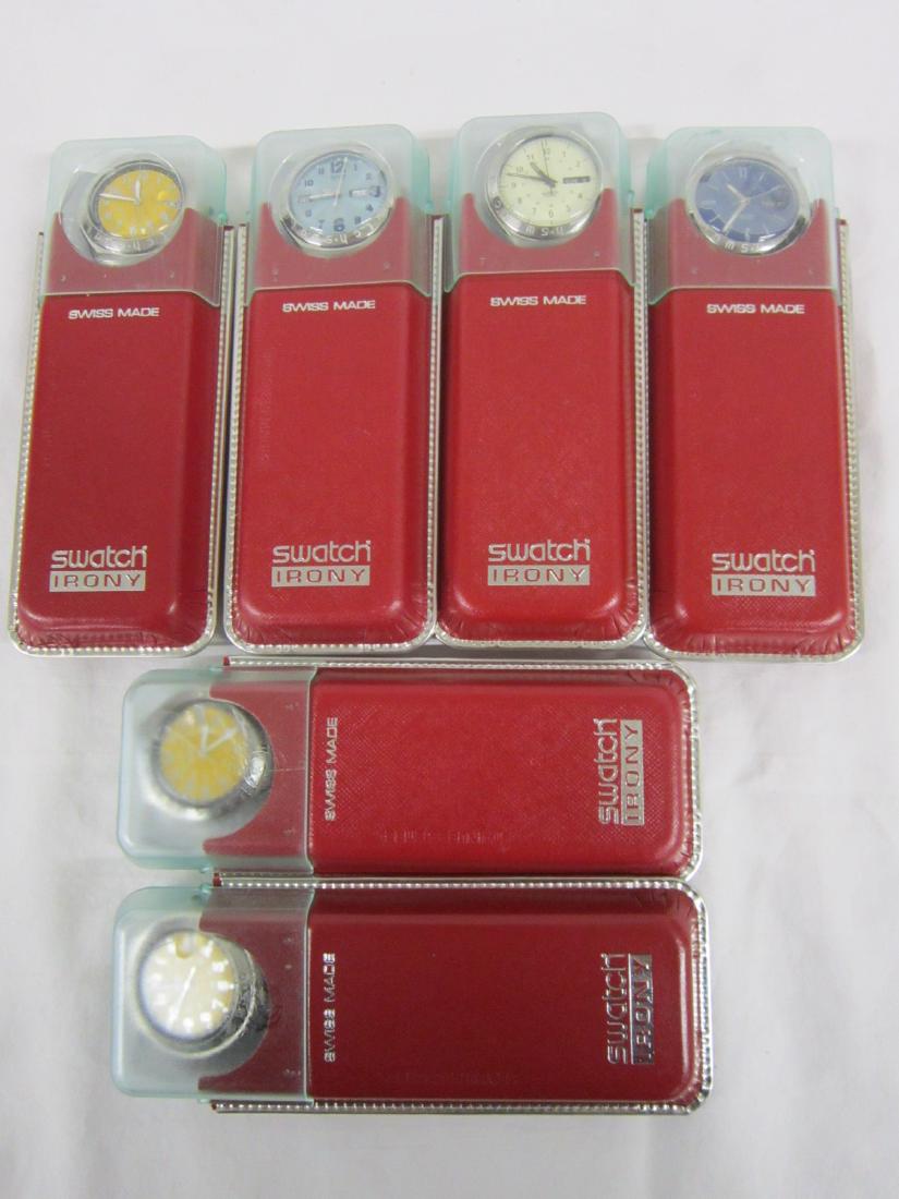 6 Swatch Watches in Original Cases: Six Swatch Watches in Original Cases, Irony, new old stock, in red cardboard and plastic top cases with folded information sheet including: Inamorato, YGS 709, 1998, Pergamena, YGS 708, 1997; Inertia,