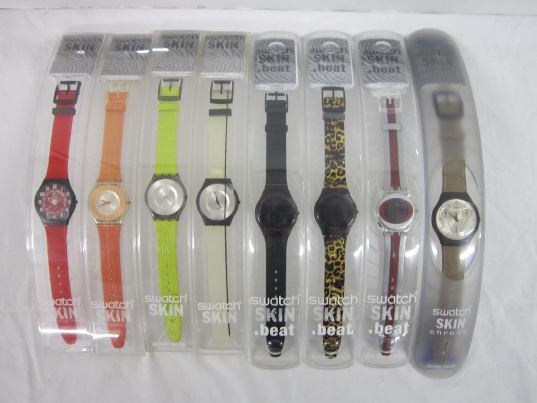 8 Swatch Watches Skin In Original Cases: 8 Swatch Watches Skin In Original Cases, new old stock, all in curved hard plastic cases with folded information sheets including: Kalahari (Chrono), Suyc 100; three Skin Beat; Pardo, SIB 100C; Ellipt