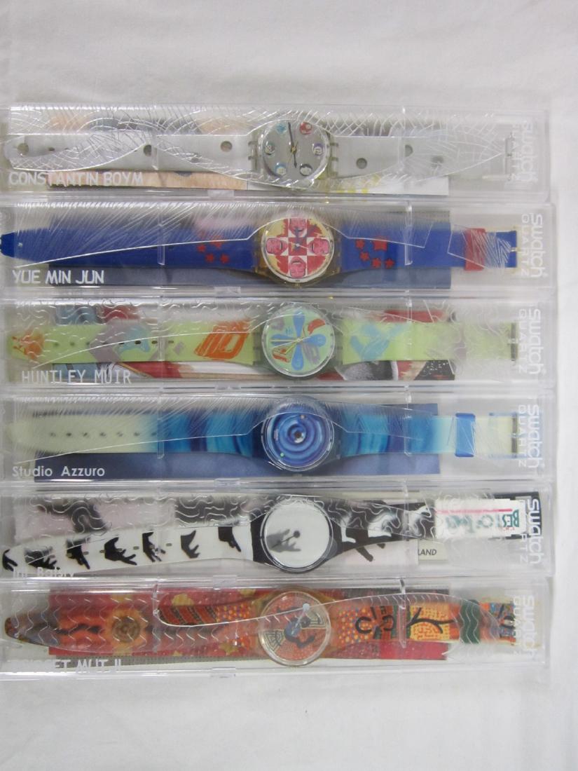 6 Swatch Watches In Original Cases: 6 Swatch Watches In Original Cases, limited edition designer watches, new old stock plastic cases with folded information sheets including: Tempo Naturate (Studio Azzuro), GK 232; Wild Laugh (Yae Min