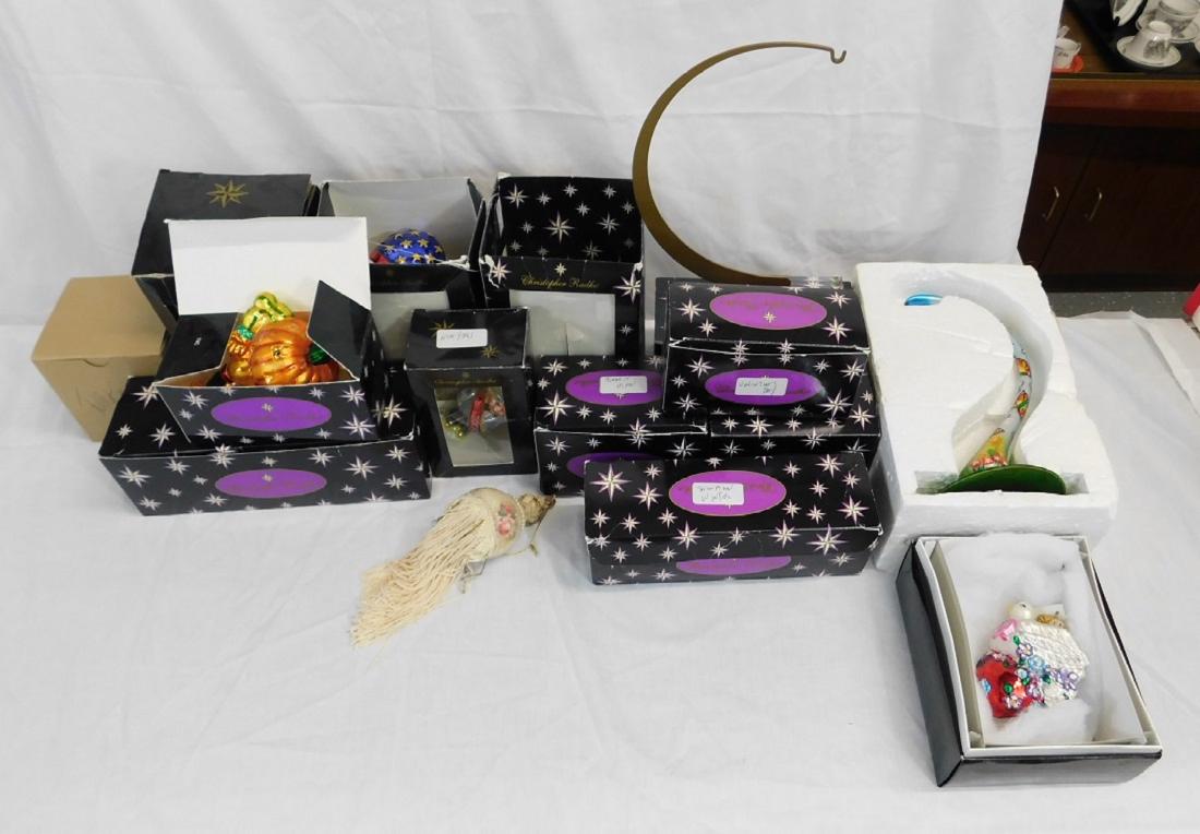 Twelve Chistopher Radko Christmas Ornaments: Twelve Chistopher Radko Christmas Ornaments: all circa 2000, representing various holidays, along with a hand-painted glass ornament stand and two other Christmas ornaments. Various sizes. CONDITION: 