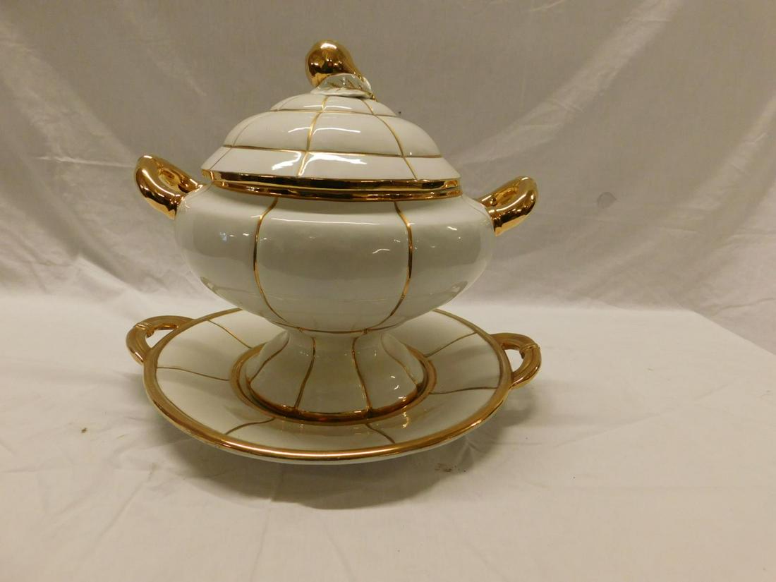 Italian Large Scale Tureen: Italian Large Scale Tureen, white ceramic with gilt pear finial lid, gilt handles and striping, includes under plate, 16" dia. x 13 1/2" h. 20th c. Condition; very minor gilt wear