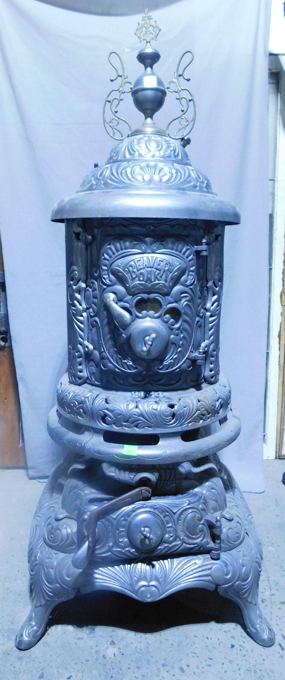 Beaver Oak Pot Belly Stove: Beaver Oak Pot Belly Stove, nickel-plated fancy cast iron, model 21-4, with brass urn and scroll crest, late 19th C, 61"h. CONDITION: Very good, restored, used condition.