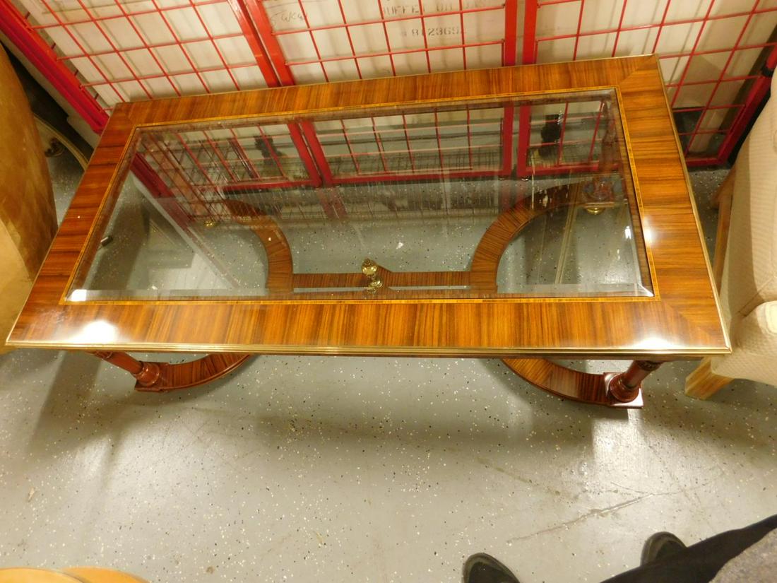 Exotic Wood Coffee Table: Exotic wood coffee table with inlaid trim and brass mounts, beveled glass inset top, 28" x 54" x 18 1/2", late 20th c. Condition; very good, no issues noted