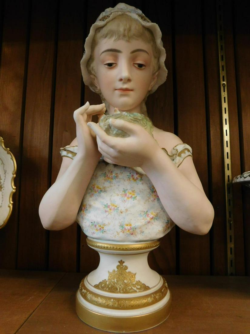 Antique German Bisque Bust: Antique German Bisque Bust, hand painted half bust of young girl holding a nest with three baby birds; intricate floral painted blouse, late 19th C, 20"h. CONDITION: Some gilt loss along pedestal base