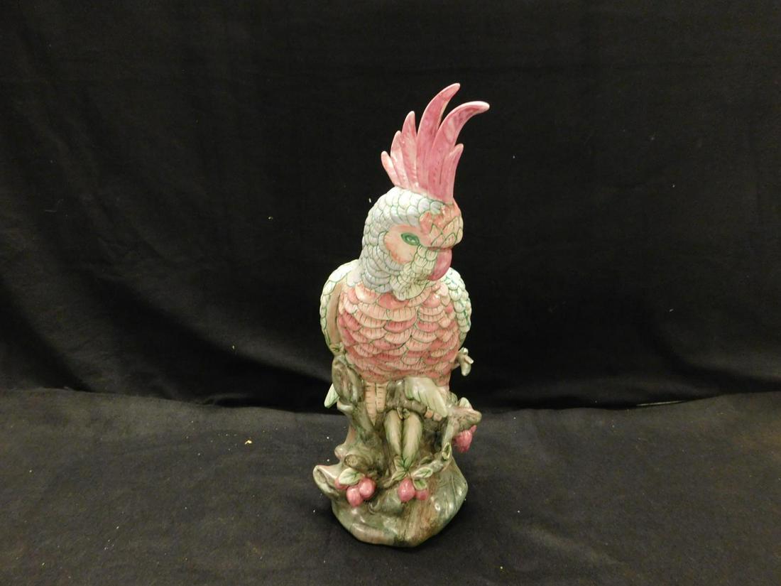Chinese Porcelain Cockatoo: Chinese Porcelain Cockatoo, the bird rests upon a green stump with berries and leaves, 17 3/4"h, late 20th C. CONDITION: Missing one small leaf on base.