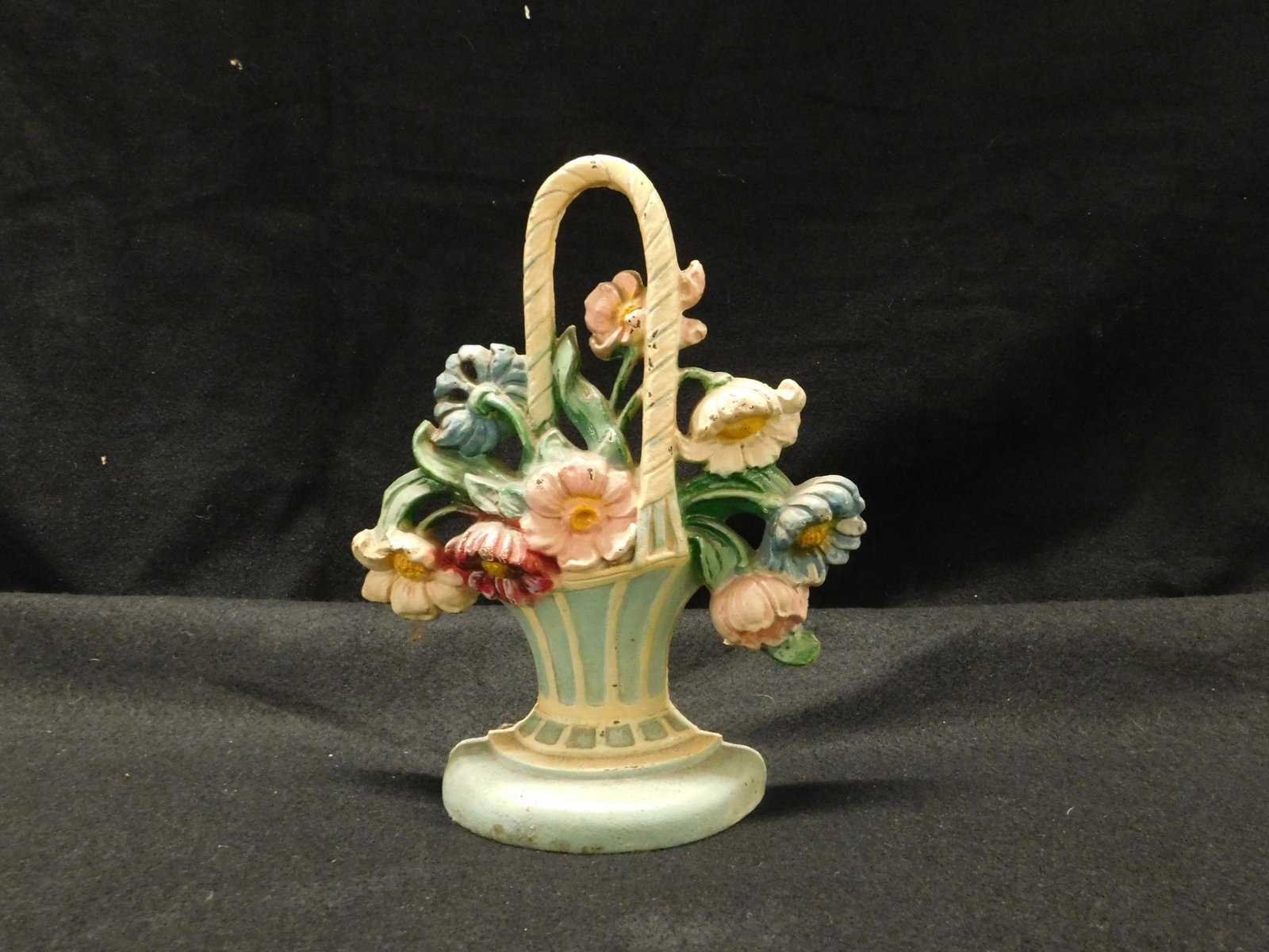 Flower Basket Door Stop: Flower Basket Door Stop, cast iron, possibly Hubley, No. 182, original paint, early to mid 20th C, 9"h, 7 1/2"l. CONDITION: Very good, very minor paint chipping.