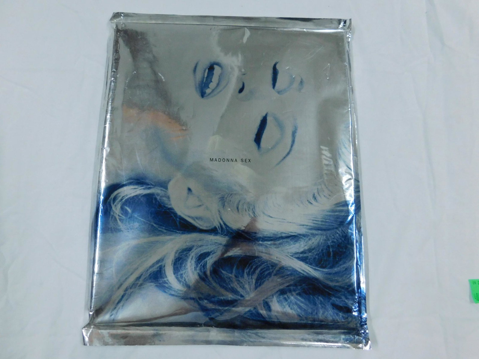 Madonna Sex Book: Madonna, Sex, Warner Books, New York, 1992. Spiral bound in metal boards, with accompanying CD. Sealed in silver Mylar pictorial printed bag, as issued.