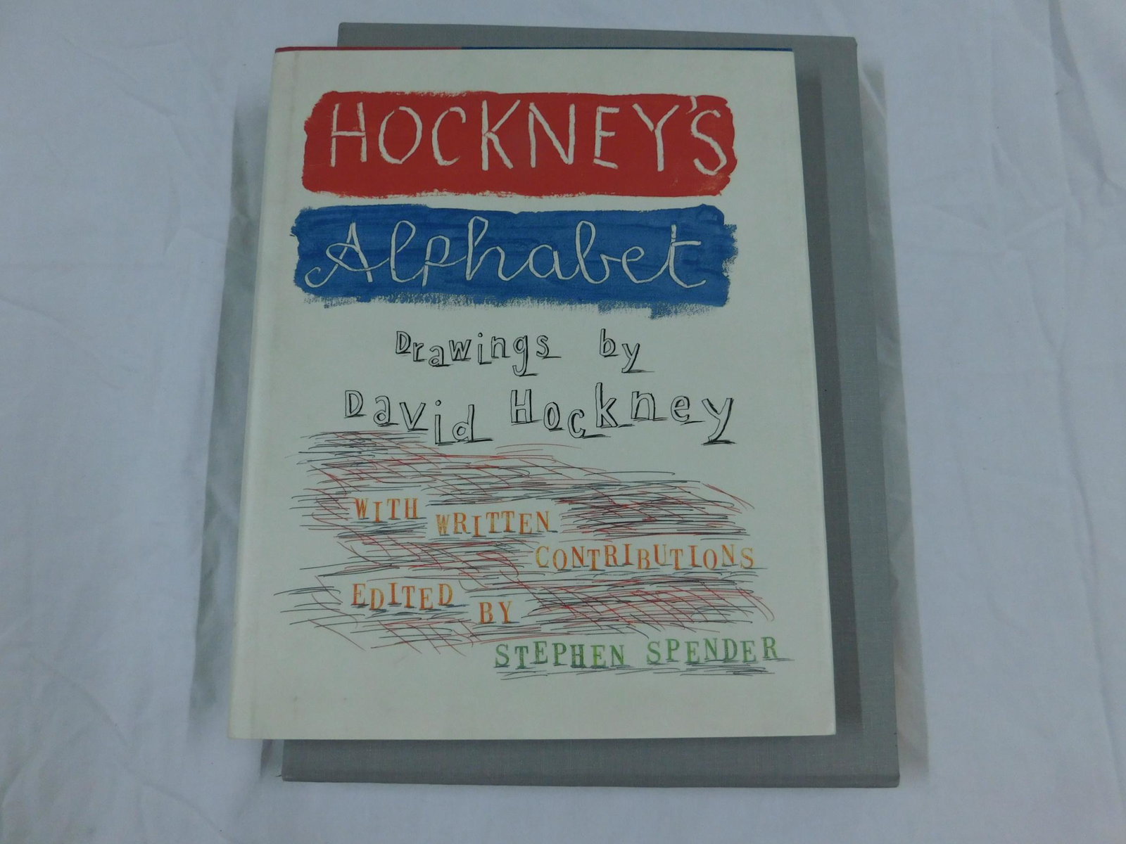 David Hockneys Alphabet Sgd Ltd Ed: [2 items] Hockney, David, Hockney's Alphabet, Faber & Faber, London 1991. A copy of the "Special Edition" of this volume, bound in yellow cloth, housed in a grey cloth-covered slipcase. Signed by the 