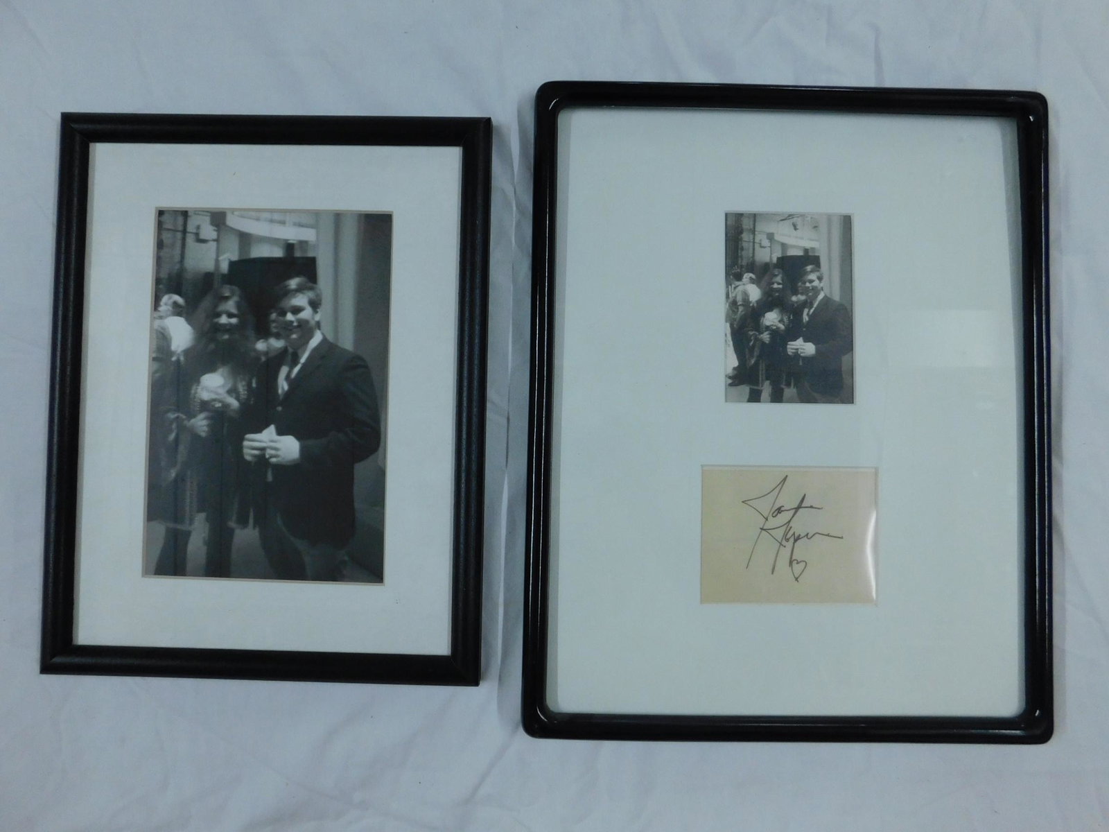 Janis Joplin Autograph: [2 items] A cut autograph from musican Janis Joplin (1943-1970), framed with a vintage photo of the singer with Albert J Raman as a young man. Mr Raman apparently received this autograph in person whe