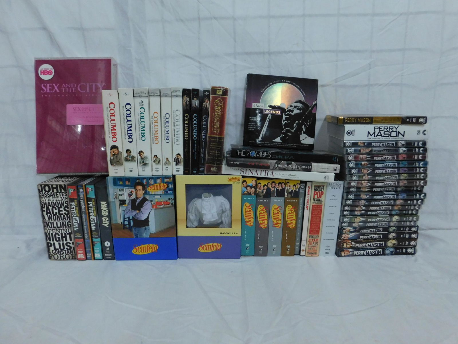 DVD Box Set Lot: A collection of DVD box sets and series set. Description to follow; includes Seinfeld, Colombo, Perry Mason Peter Gunn, John Cassavetes, Sex and the city etc. along with CD box sets of Simon & Garfunk