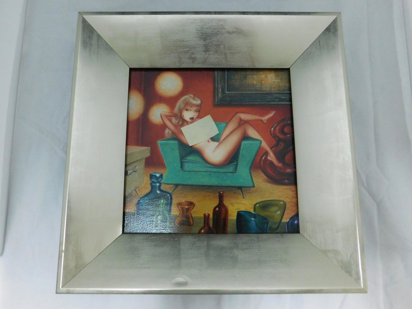 Keith Weesner "Lounge Muse" Acrylic on Board: A framed acrylic on board by retro/vintage pinup artist Keith Weesner, titled "Lounge Muse", painted in 2007. It's of a sultry blond lounging nude across a vintage style chair in a 50s/MCM style room.
