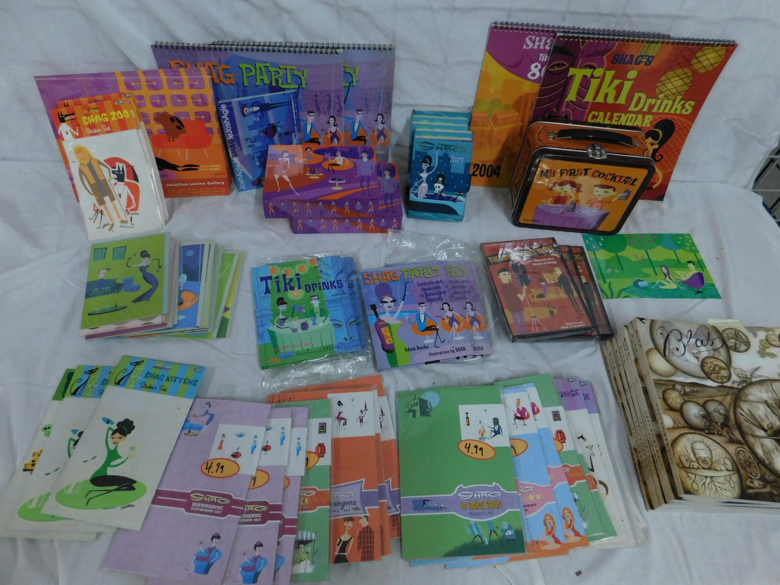 Shag (Josh Agle) Ephemera Lot: [box of items] Six copies of Blab magazine issue #17, which contains a cartoon by Shag; 2003-2004-2005 Calendars, two pencil boxes (one full of Shag notecards), five Shag postcard sets, three copies o