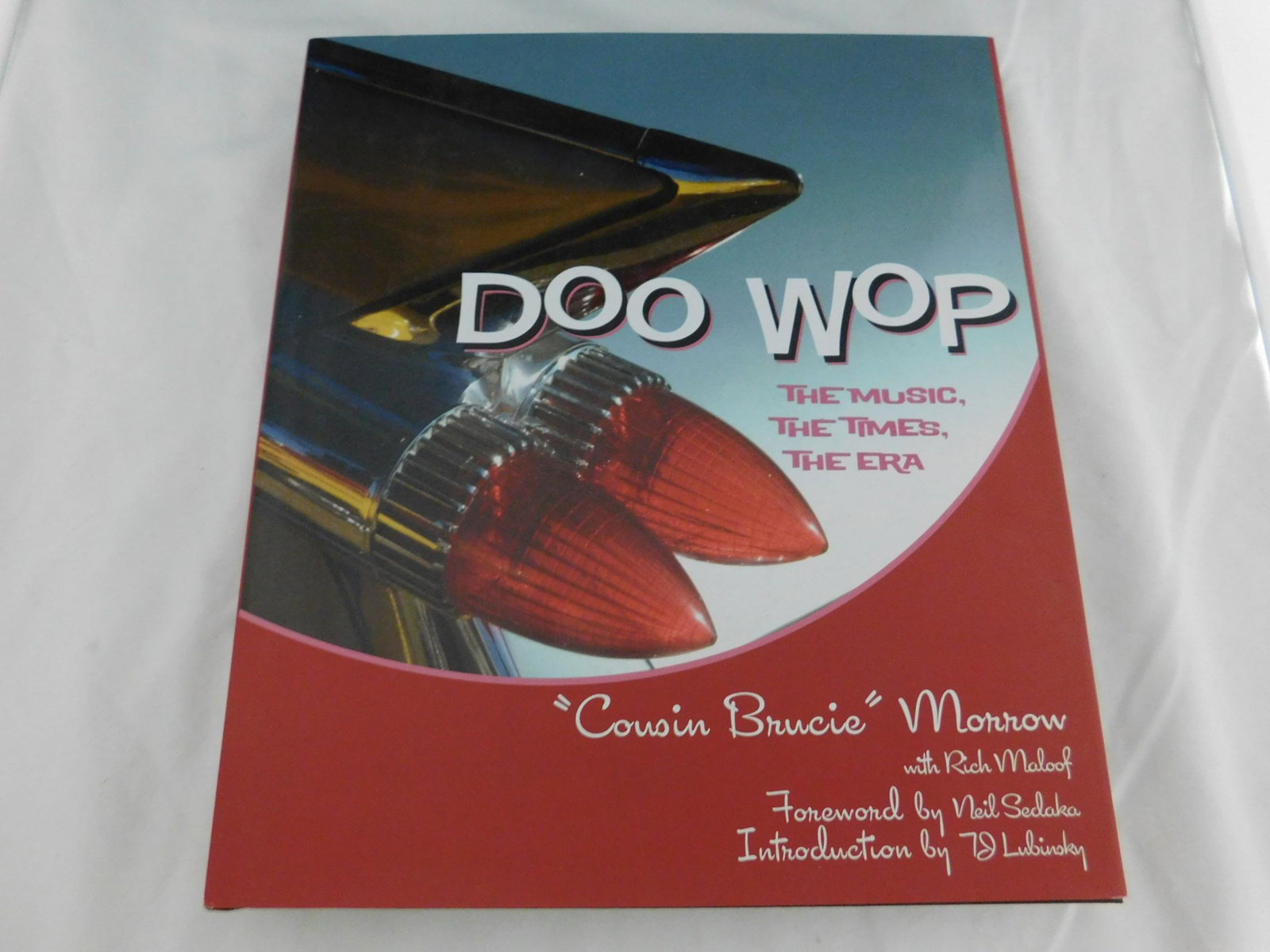 "Cousin Brucie" Doo Wop Signed 1st Ed: Morrow, Bruce "Cousin Brucie" & Maloof, Rich, Doo Wop: The Music The Times The Era. Signed by the author/DJ/personality on the title page, which a dedication to "cousin Albert" and by Rich Maloof. Fro