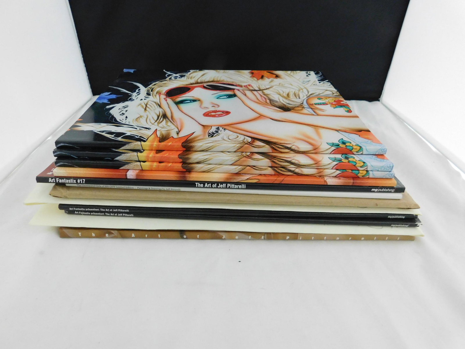 Jeff Pittarelli Books: [13 items] A gorup of books about erotic/pin-up artist Jeff Pittarelli, including: Pittarelli, Jeff, Jeff Pittarelli, SQP Inc, Howell, 2002 (hardcover, #330 of a signed, limited edition of 600); Art F