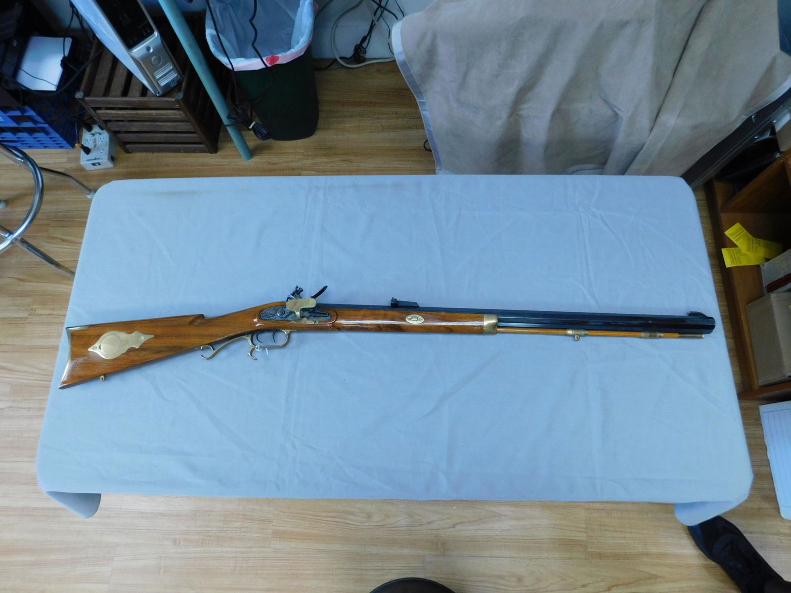 Thompson Center Arms Reproduction Flintlock Rifle: Thompson Center Arms Reproduction Flintlock Rifle, 45 caliber black powder, Hawken walnut stock with brass mounts, twin triggers, blued octagon 29" blued steel, adjustable sight; serial #K251319, over