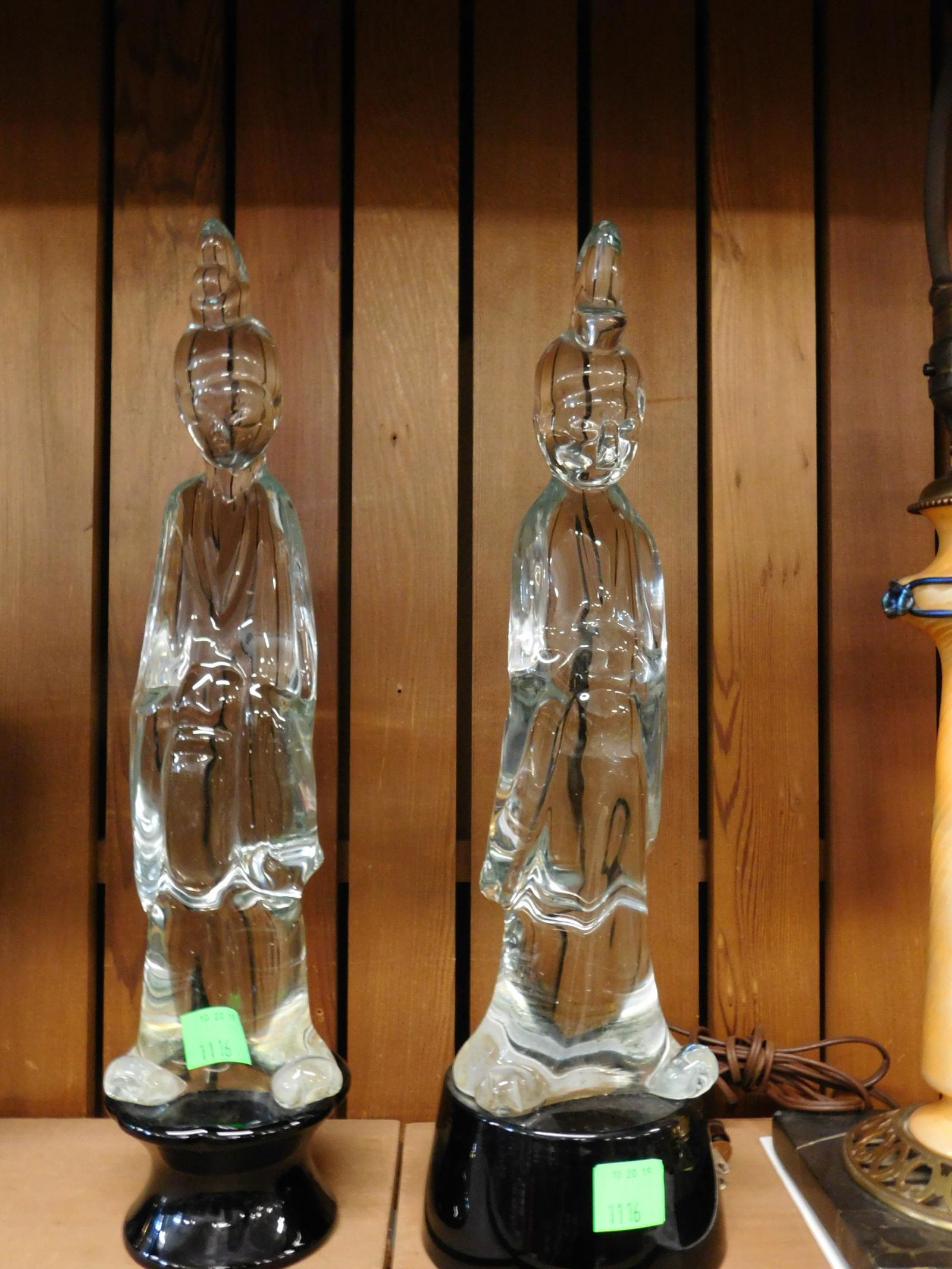 Two Murano Crystal Guan-yin Figures: Two Murano Crystal Guan-yin Figures. Two figures of Guan-yin, the goddess of compassion, hand-made in hot-worked glass in the style of Loredano Rosin or Cenedese. On black glass bases. Both inscribed