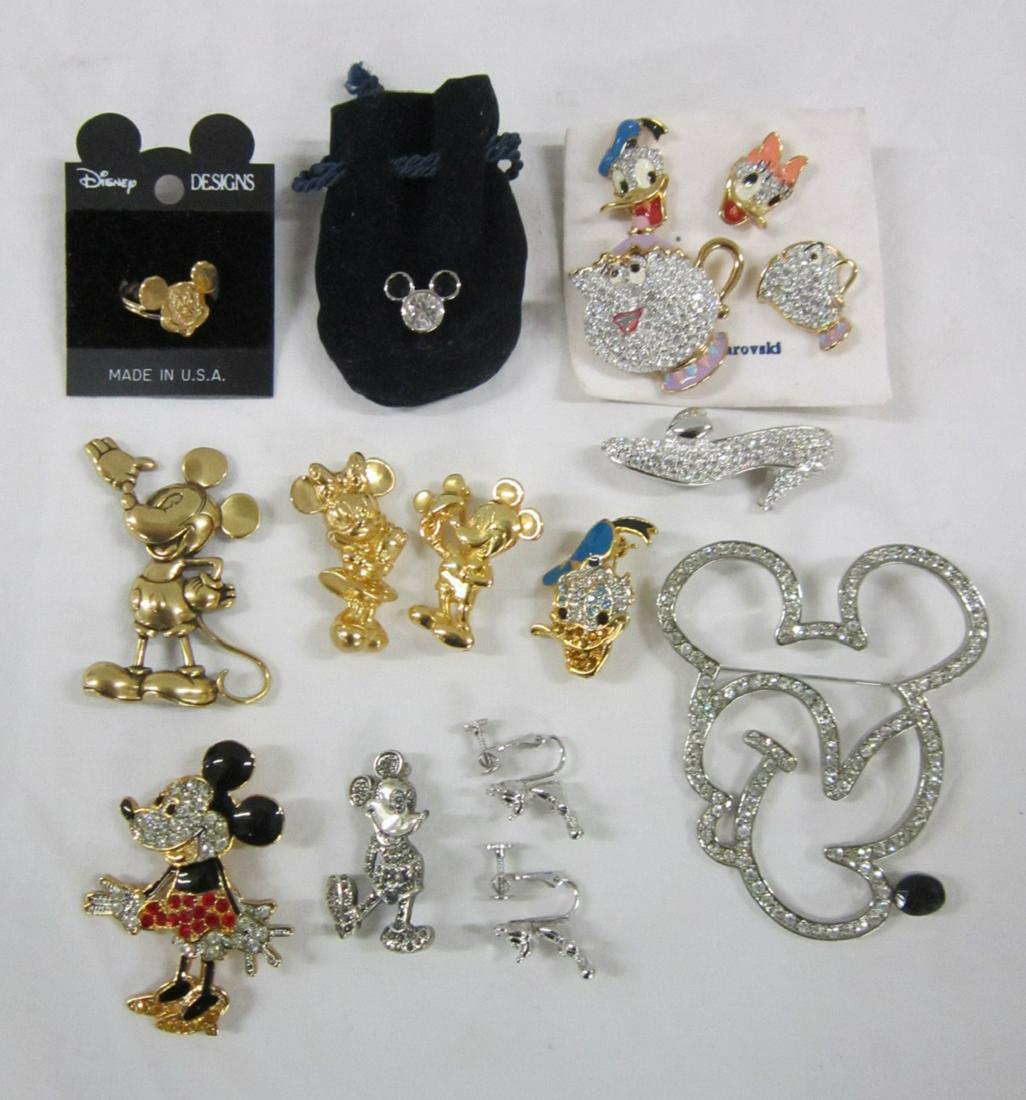 Lot Disney Rhinestone & Other Jewelry: Lot Disney Rhinestone and Other Jewelry including: one sterling (marked on back) and marcasite Mickey Mouse pin, 1 5/8", three gold tone pins, Mickey, Minnie, 1 1/2" and 1 3/4" and Mickey, 2 1/4", lar