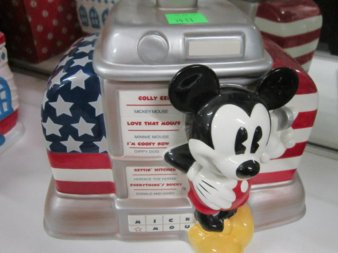 Mickey Jukebox Cookie Jar: Mickey Jukebox Cookie Jar, Disney Direct, item #64030, featuring pie-eyed Mickey in front of stars & stripes Jukebox, 7" x 12" x 10 1/4" h. CONDITION: No issues identified.