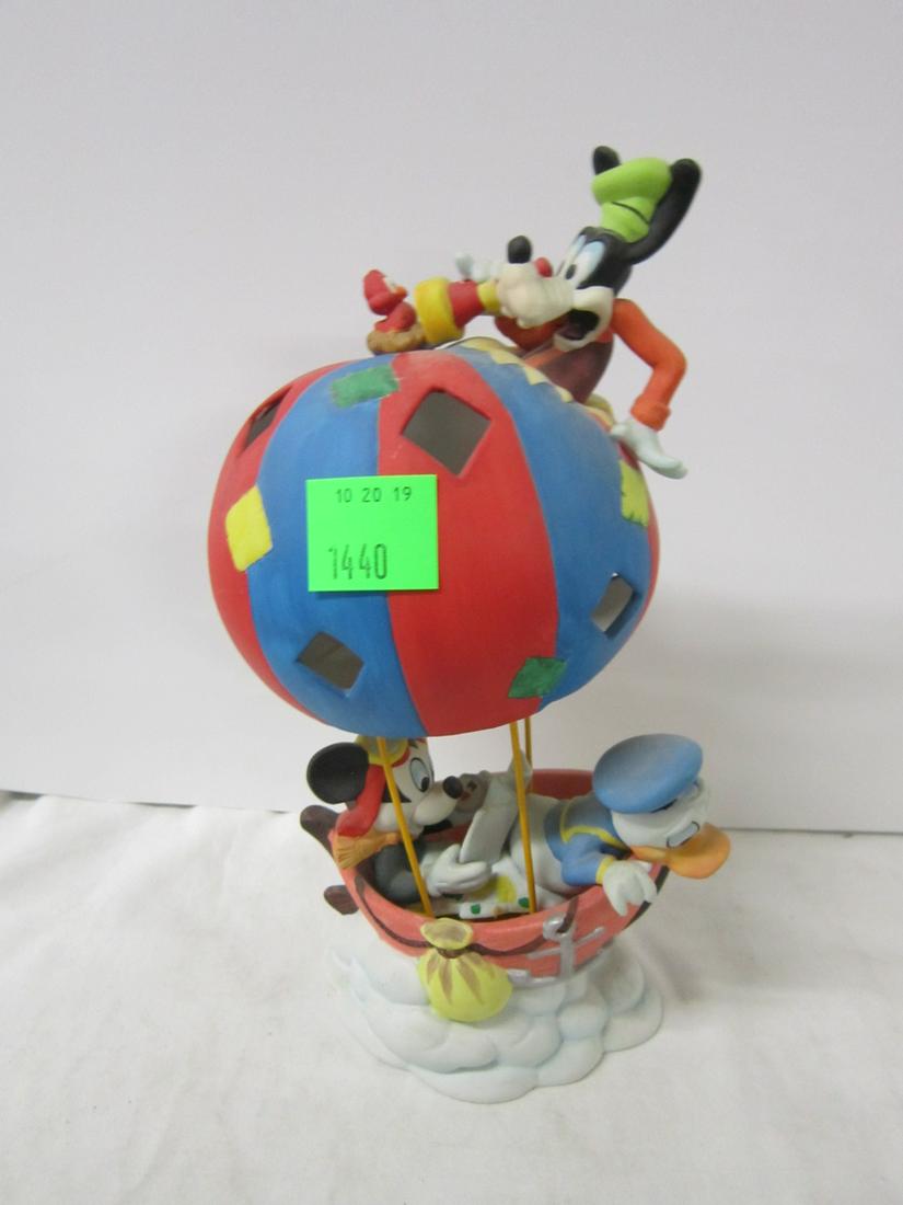 Enesco Disney Porcelain Figurine: Enesco Disney Porcelain Figurine, Mickey and Friends in balloon, Mickey with map, Donald looking over edge of basket, Goofy through top of balloon looking at bird, Mickey & Co., 11"h. CONDITION: No is