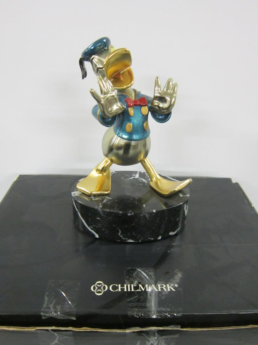 Chilmark Metal Art Sculpture Donald Duck: Chilmark Metal Art Sculpture Donald Duck, hand painted, limited edition, 7 1/4" on an oval marble base, 4" x 6" x 2"h, 1995, 9 1/4" overall height in styrofoam with original box. CONDITION: No issues 