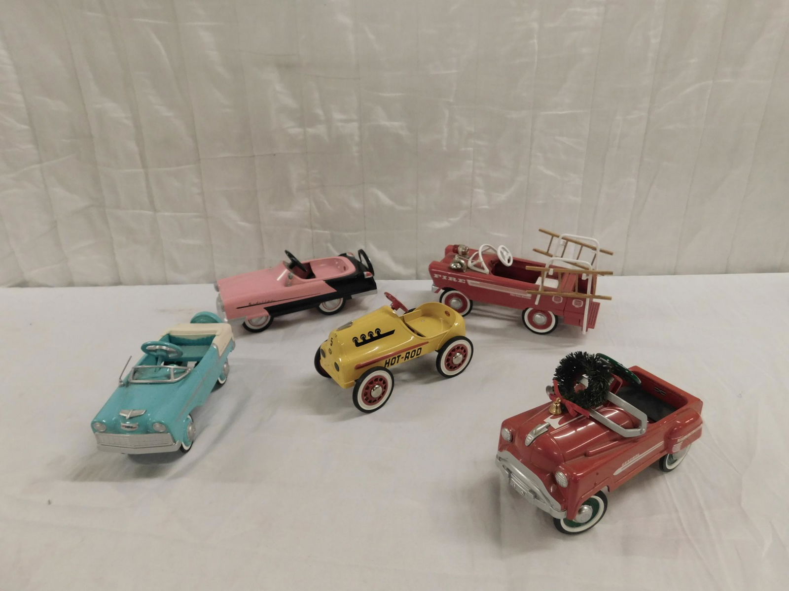 5 Hallmark Scale Model Redal Cars: Five Hallmark Scale Model Redal cars including: Fire truck (with two wood ladders), Pink "Kidillac", 1955 Chevy Bel air, Hot Rod (Garton Toy Co.) and Murray "Holiday General" (Jet Flow Drive), with at