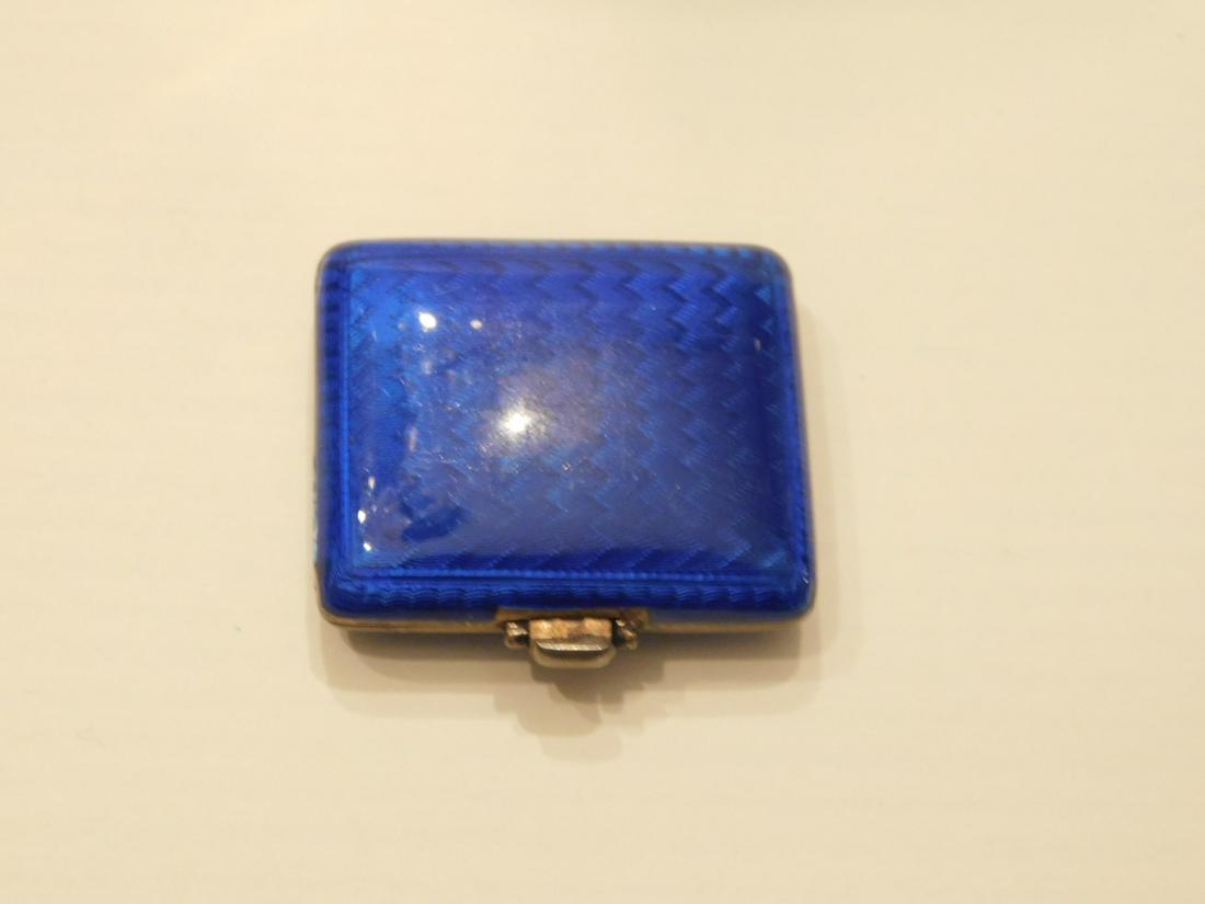 Blue Guilloche Silver Travel Watch: Enameled Silver Travel Watch, Juvenia, gold washed silver case with blue Guilloche enameling; 1 1/2" x 1 3/8" x 1/2' fold up case with fold out stem wind watch having a gold tone dial with Arabic nume