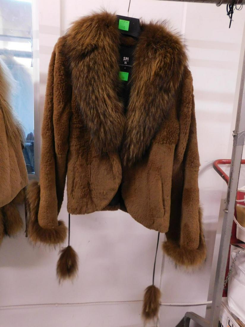 Rabbit & Racoon Jacket: Sheared rabbit and Finland raccoon trim, collar, cuffs and tassels, rabbit with two pockets, from Sandy Pino International, arms 23", shoulders 17", length 24". CONDITION: Very good, lightly worn.