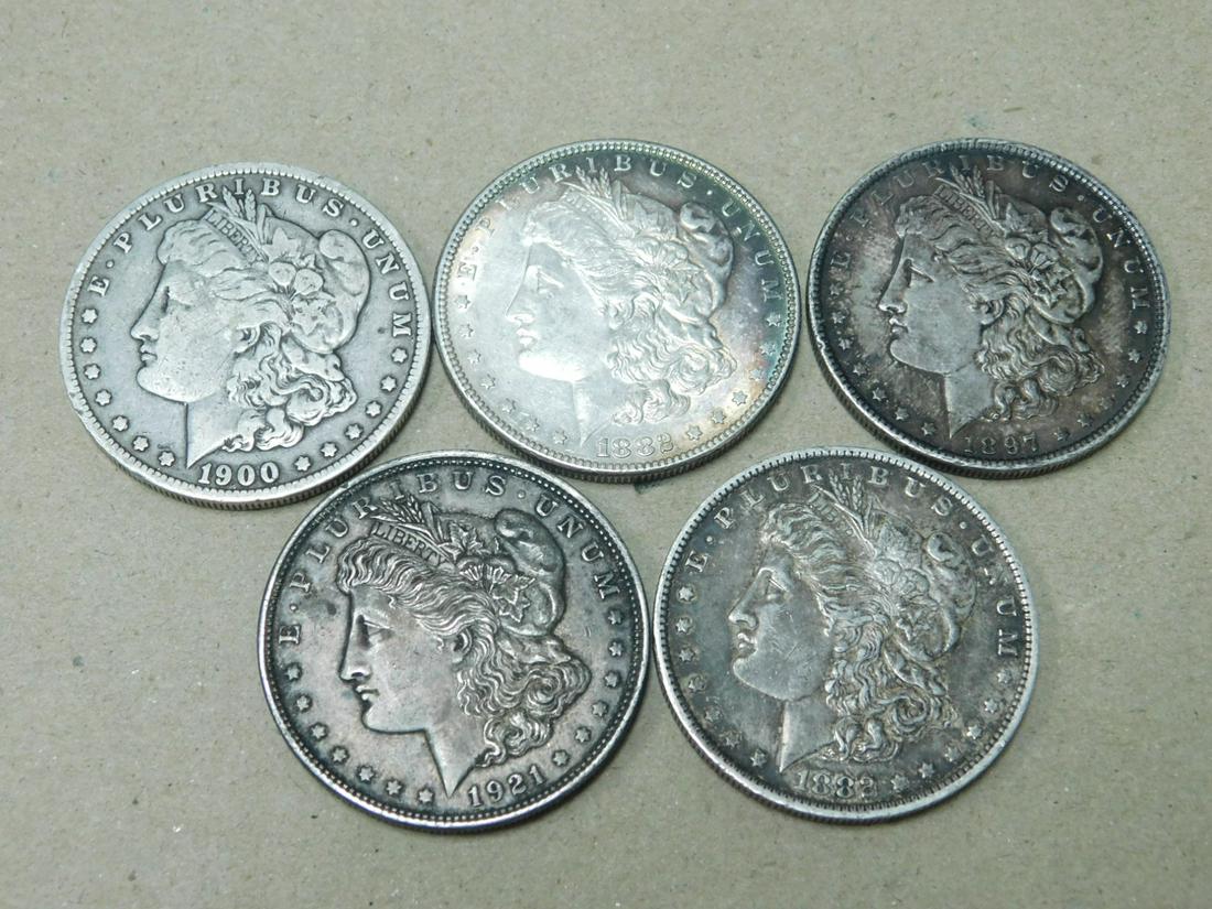 5 Morgan Silver Dollar: 5 Morgan Silver Dollar A: 1882 UNC with toning B: 1882 O AU C: 1897 UNC D: 1900 O VF E: 1921 Morgan UNC Condition: based on using photography