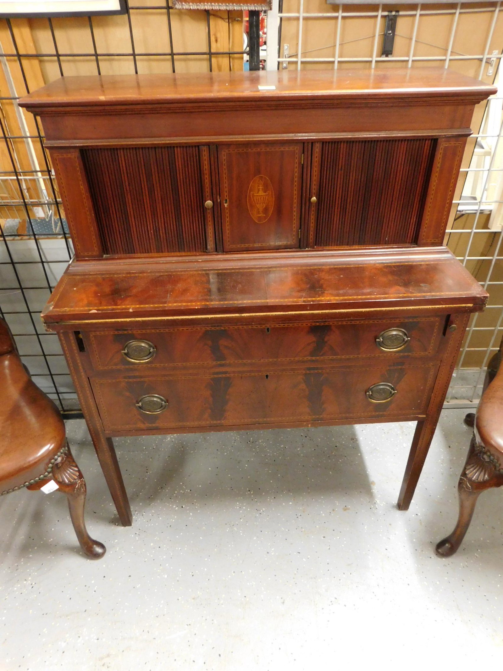 Hepplewhite Style Lady's Desk: Hepplewhite Style Lady's Desk by Charak Furniture Co., mahogany with urn and Herringbone inlays; in two parts; top: mold edge lift lid top over tambour doors covering letter slots and drawers, flankin