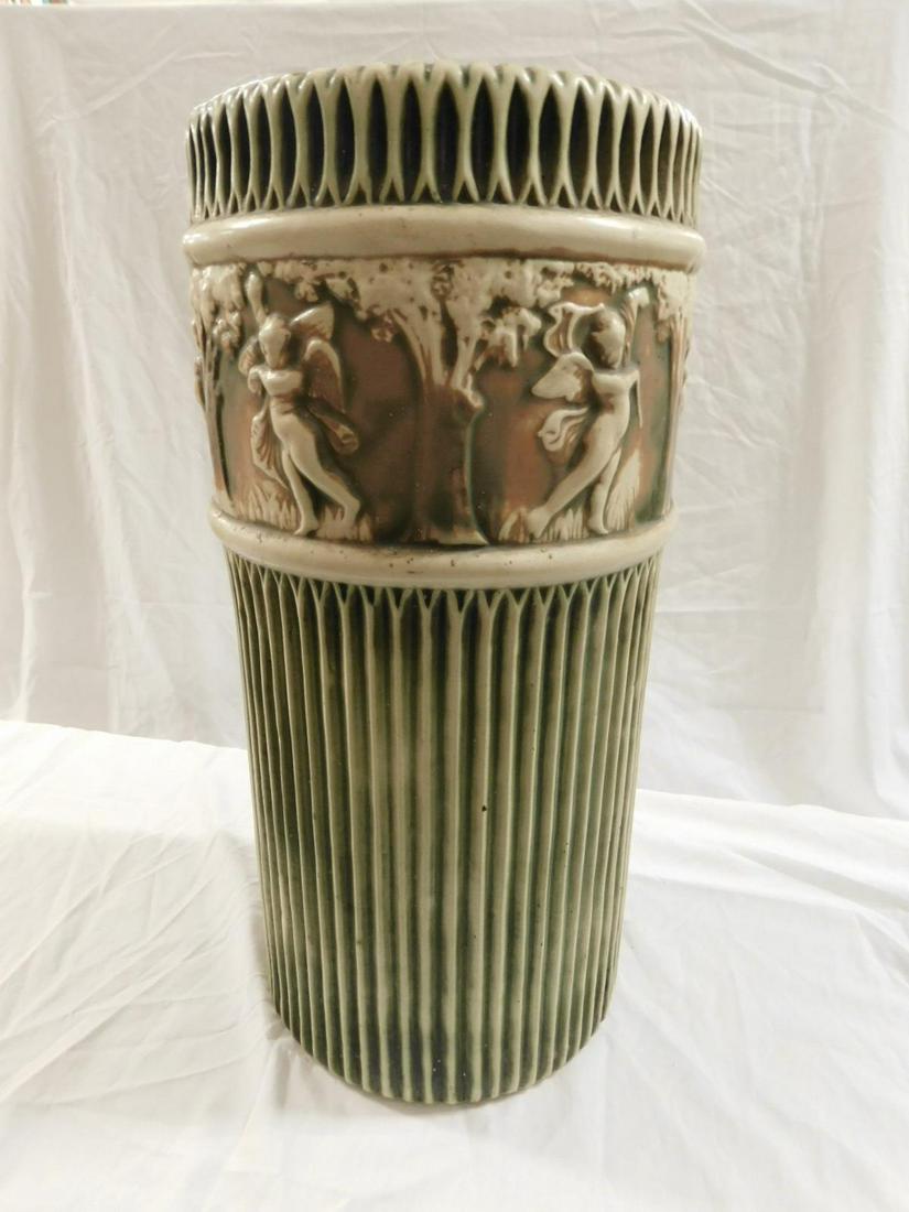 Roseville Donatello Umbrella Stand: Roseville Donatello Umbrella Stand, green ribbing with wide beige band of cherubs in garden setting, 20 1/2" h. CONDITION: all-over crazing, short (0.75") hairline in rim.