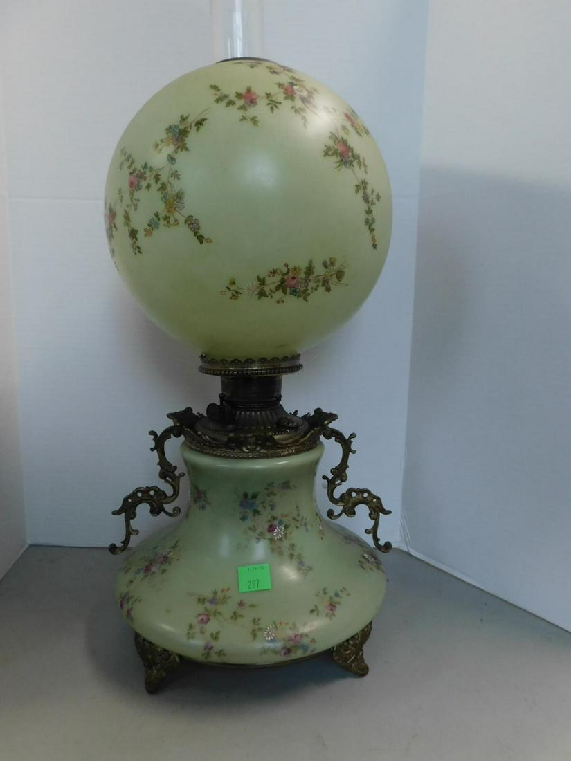 Gone With The Wind Fluid Lamp: Gone With The Wind Fluid Lamp, celery green glass finish body and shade with petite red rose clusters, elaborate cast scroll work arms and base, height to chimney top 27 1/2", late 19th C. CONDITION: