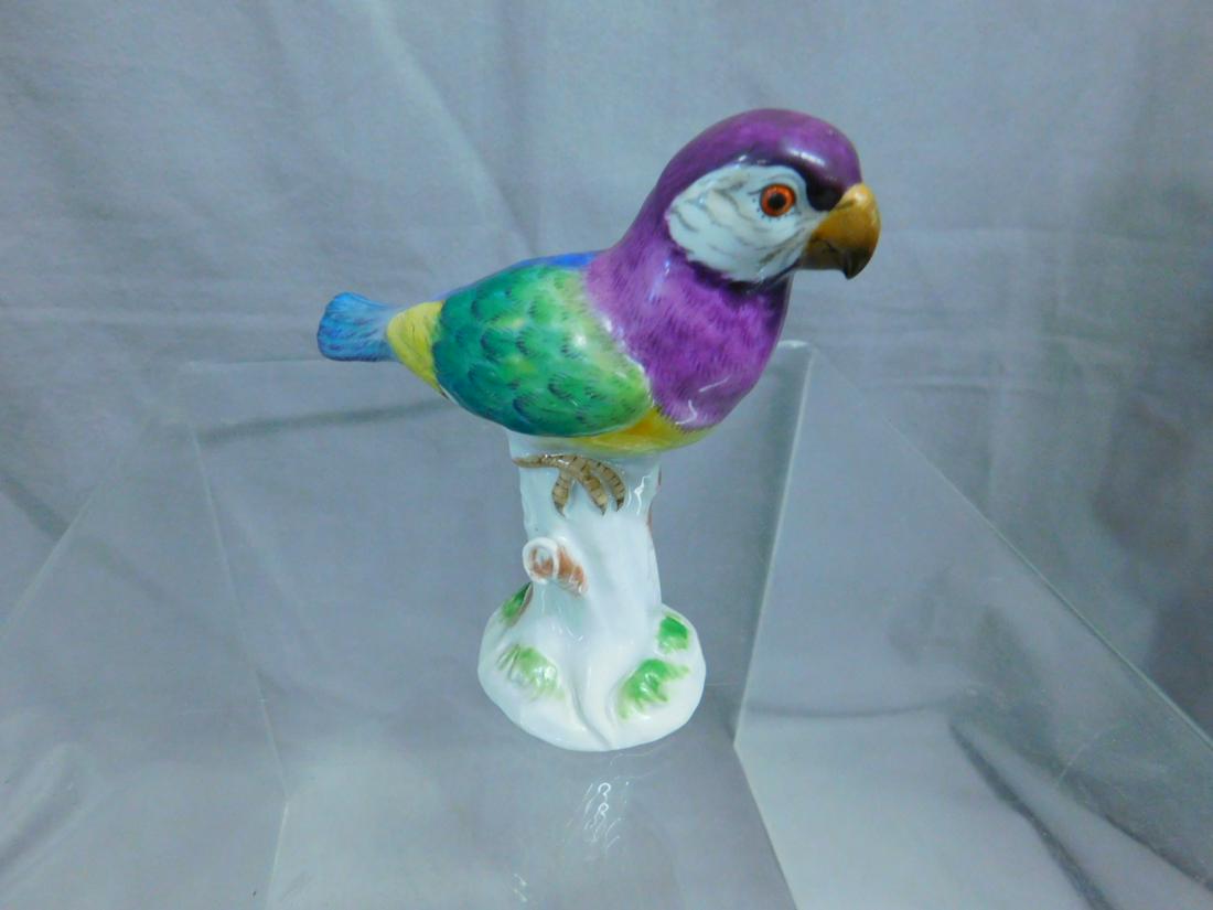 Meissen Parrot Figure: Meissen Parrot Figure, porcelain with early blue cross sword mark and incised mold # "450", the parrot in lavender, blue, green and yellow rests upon a tree stump, 19th C, 4 1/2"h, 4 1/2"l. CONDITION:
