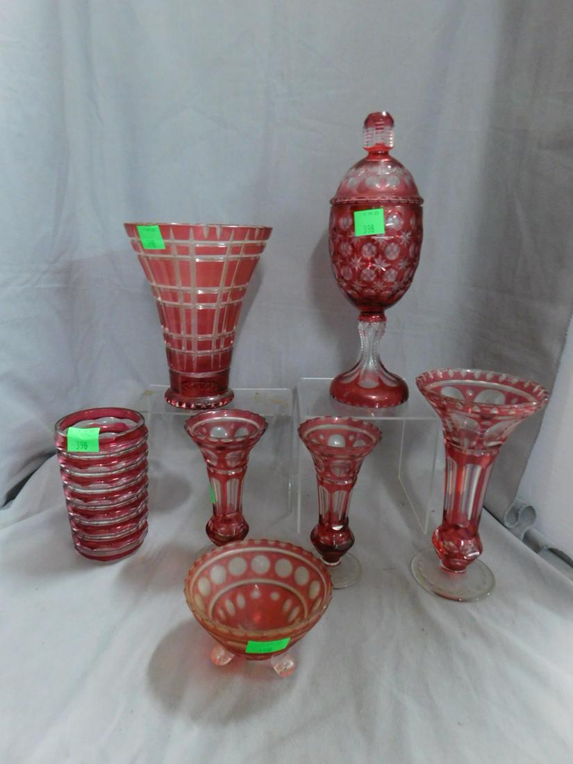 8 Ruby Cut to Clear Glass Pieces: Eight Ruby Cut to Clear Glass Pieces includes: 13" covered candy jar, two 8 1/2", 6", two 5 1/2" vases, and a 3" high bowl, mid 20th C. CONDITION: Very good, no issues identified.