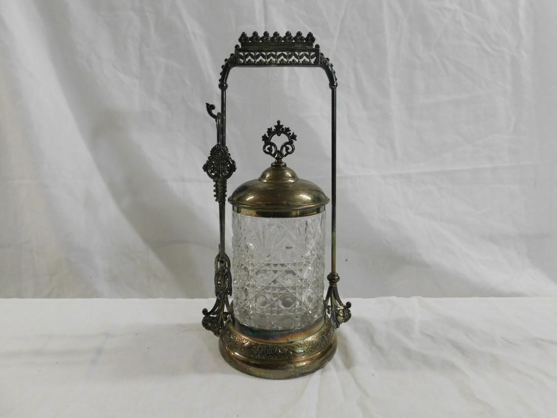 Victorian Pickle Caster: Victorian Pickle Caster, molded clear glass caster with cane and fan motifs, rests in a Meriden silver plate stand with bead and leaf open work crest, plus tongs, 9 7/8"h, circa 1880-1895. CONDITION: 
