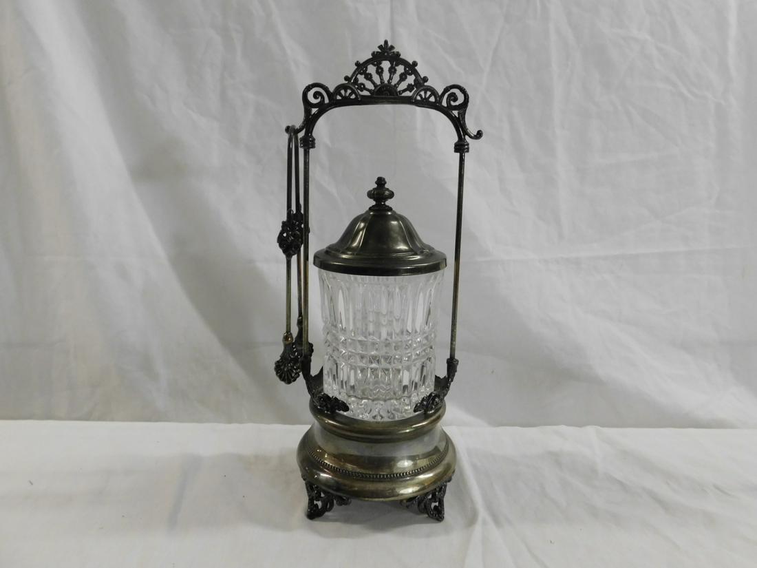 Victorian Pickle Caster: Victorian Pickle Caster, clear glass rib molded caster sets in a Forbes silver plate stand with pierced arched and rosette crest, plus tongs, circa 1880-1890, 11 3/4"h. CONDITION: Very good tarnished.