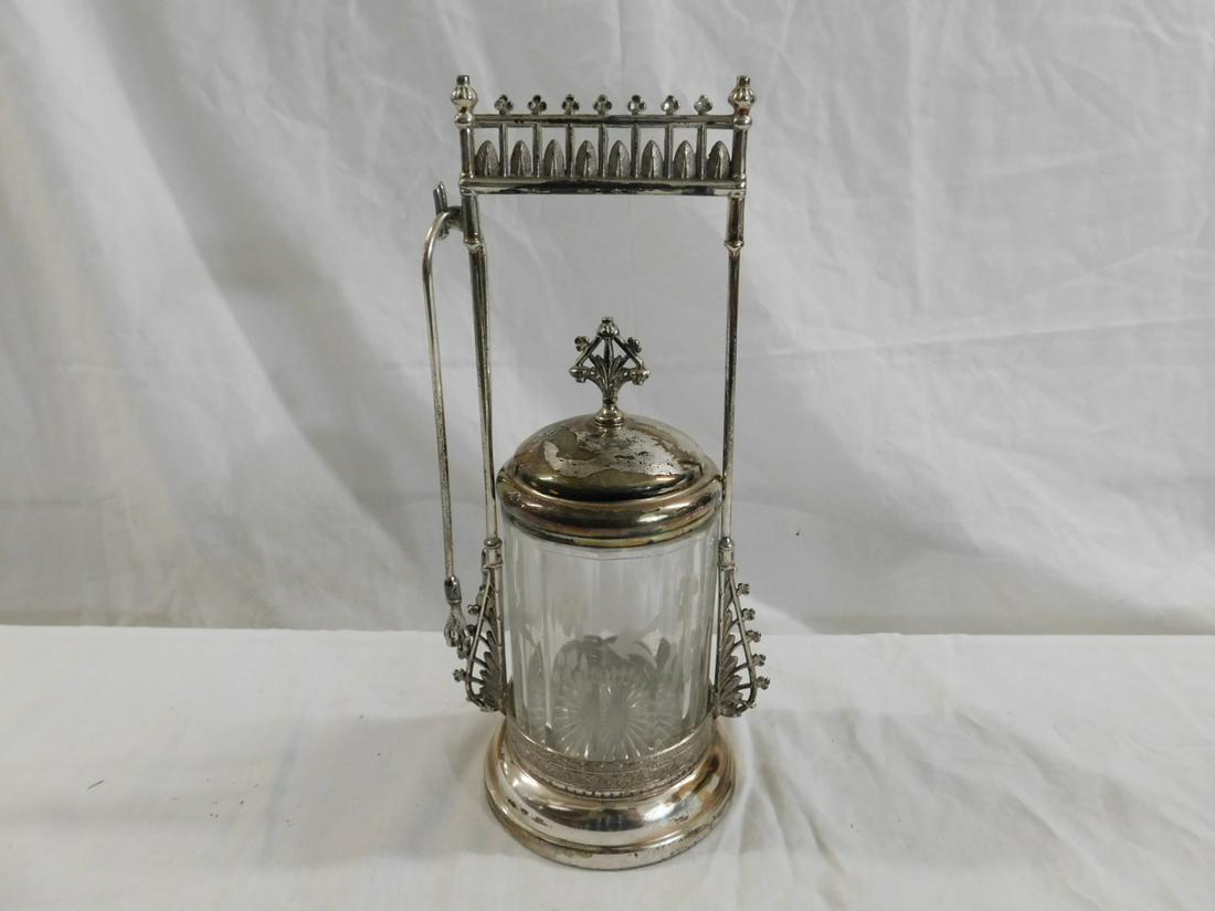 Victorian Pickle Caster: Victorian Pickle Caster, clear glass paneled caster with lightly etched design, rests in a John Carrow, Philadelphia quadruple plate stand with leaf and rod paneled top; includes: tongs, circa 1880 - 