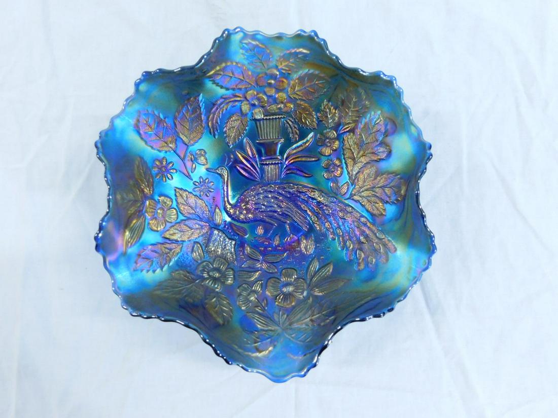 Fenton Peacock & Urn Carnival Glass Bowl: Fenton Peacock & Urn Carnival Glass Bowl, ruffled rim, extremely livid blue with copper highlights. Early 20th c. Size: 8.75" across. CONDITION: Light wear to bottom of foot, otherwise fine.