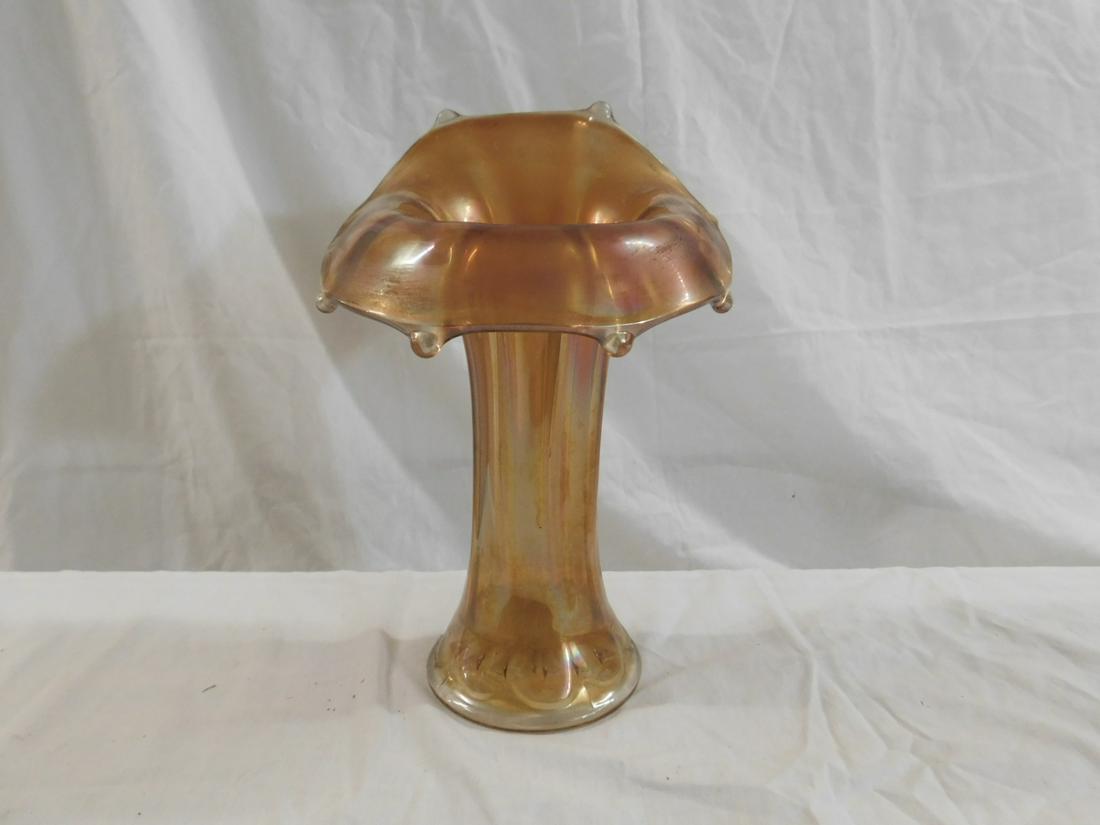 Imperial Morning Glory Carnival Glass Vase: Imperial Morning Glory Carnival Glass Vase, marigold color, jack in the pulpit form. Eight exterior ribs, 16-point srar on base. Early 20th c. Size. 3.875" in diameter at base, 10.125" tall. CONDITION