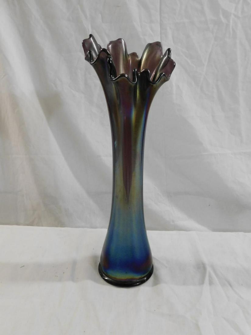 Imperial Freefold Carnival Glass Swung Vase: Imperial Freefold Carnival Glass Swung Vase, in purple. Base is 3.25" in diameter, height is 12.5" CONDITION: Wear to edge of bottom, otherwise fine.