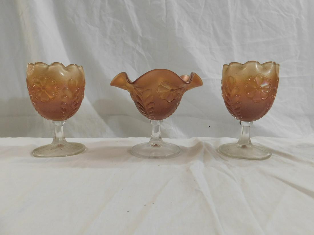 Northwood/Dugan Daisy & Plume Carnival Glass: Northwood/Dugan Daisy & Plume Carnival Glass. Three pieces of vintage carnival glass in the Daisy & Plume pattern in marigold, which was made by Dugan and Northwood. This lot consists of two footed ro