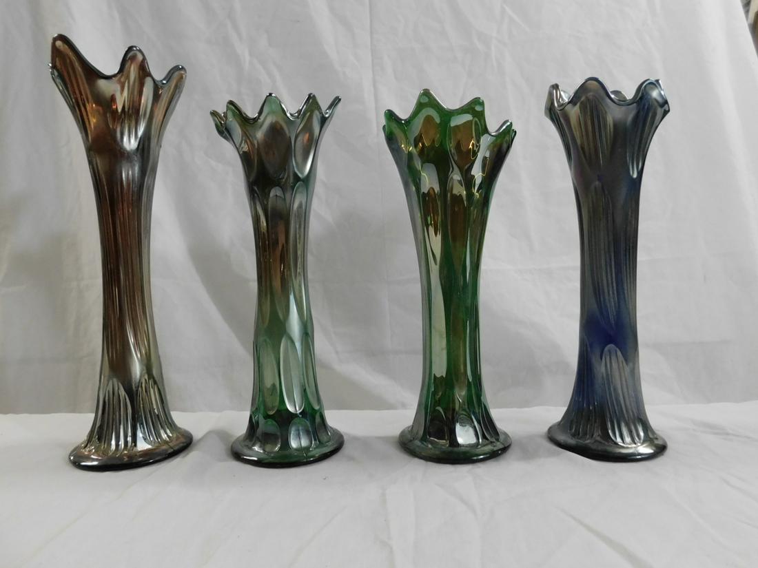 Four Fenton Carnival Glass Swung Vases: Four Fenton Carnival Glass Swung Vases. Four vintage carnival glass swung vases made by Fenton, two Long Thumbprint and two Diamond and Rib. The two Long Thumbprint vases are both purple, the Diamond 