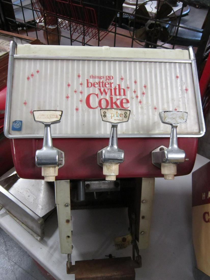 Coca-Cola Counter Top Soda Fountain: Coca-Cola Counter Top Soda Fountain "Things Go Better with Coke", three flavor dispensing arms, includes: two plastic interior tanks, three ss fittings, circa 1970-80s, 18" x 24" x 20". CONDITION: Use