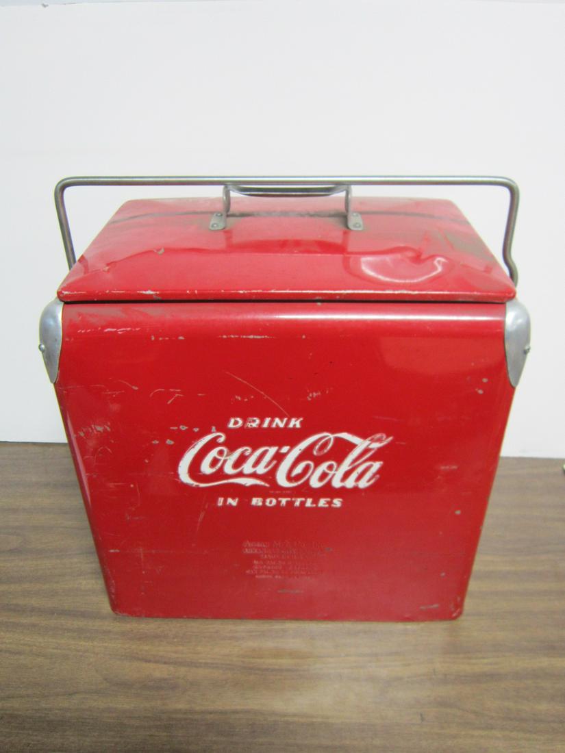 Vintage 1950s Insulated Coca-Cooler: Vintage 1950s Insulated Coca-Cooler, red painted metal with white letters "Drink Coca-Cola in Bottles" on both sides, Acton Mfg. Co. Inc. Arkansas City, Kansas, lift lid with bar hold down, galvanized